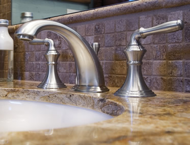 Faucets on granite bathroom countertop